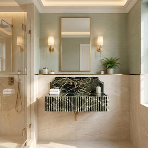 May include: A wall-mounted bathroom sink crafted from dark green marble with a fluted front design. The sink features a matching marble backsplash, gold-toned hardware, and is positioned beneath a rectangular mirror with a gold frame and two wall sconces.