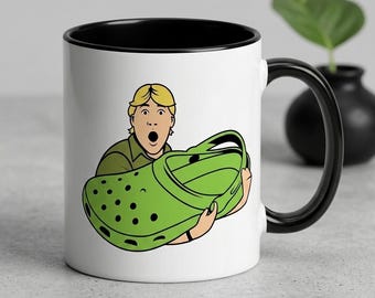 Funny Clog Shoe Lover Mug, Surprised Man Holding Green Clog Coffee Cup, Unique Gift for Shoe Enthusiast, Quirky Ceramic Mug for Croc Fans