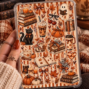 May include: A clear tablet case featuring a collage of autumn-themed stickers including pumpkins, stacks of books, a black cat, a ghost reading, maple leaves, bows, mushrooms, candles, coffee drinks, and a heart pattern on a striped background.