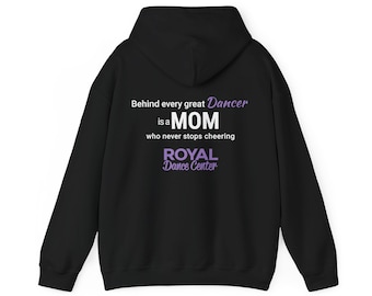 May include: A black hooded sweatshirt featuring white and purple text on the back that reads: Behind every great Dancer is a MOM who never stops cheering ROYAL Dance Center. The garment has long sleeves and a hood with a drawstring.