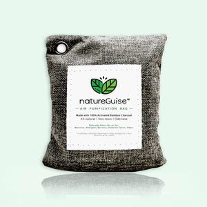 May include: A rectangular charcoal-coloured burlap air purification bag with a metal grommet in the top left corner. A white label features the text natureGuise, Air Purification Bag, and details about activated bamboo charcoal contents.