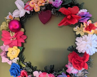 Hand made 16 inch christmas wreath.  Alternative xmas decoration.  Non-traditional christmas wreath with lights, pom moms and flowers.