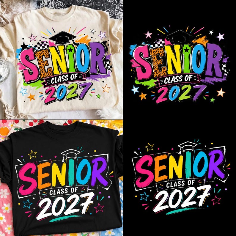May include: A cream-colored t-shirt and a black t-shirt, each featuring a colorful graphic design that reads SENIOR CLASS OF 2027. The design includes a graduation cap, stars, and brushstroke accents in pink, yellow, blue, and purple colors.