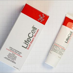 May include: A white and red LifeCell South Beach Skincare box and tube. The packaging features the text Ultra-Concentrated Clinical Skin Care, All-In-One Anti-Aging Treatment, and lists benefits like firming, wrinkle reduction, and dark spot corrector. Net wt. 2.54 oz.
