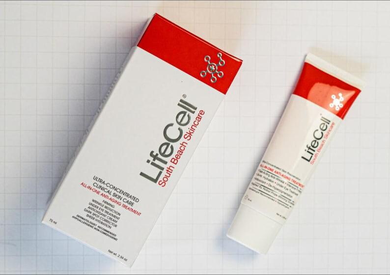 May include: A white and red LifeCell South Beach Skincare box and tube. The packaging features the text Ultra-Concentrated Clinical Skin Care, All-In-One Anti-Aging Treatment, and lists benefits like firming, wrinkle reduction, and dark spot corrector. Net wt. 2.54 oz.