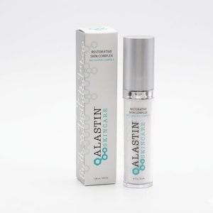 May include: A cylindrical skincare pump bottle and its matching rectangular box, both in white and silver with teal accents. The packaging features the text ALASTIN SKINCARE and RESTORATIVE SKIN COMPLEX, with a volume of 1.0 fl oz or 30 ml.