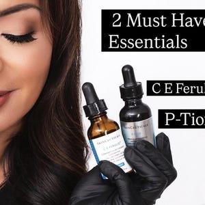 May include: Two SkinCeuticals serum bottles, C E Ferulic and P-Tiox, held in black gloved hands. Text on the image reads: 2 Must Have Essentials, C E Ferulic, and P-Tiox. The bottles feature dark glass, black dropper caps, and white labels.