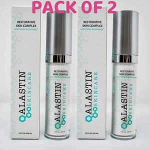 May include: A pack of two Alastin Skincare Restorative Skin Complex bottles and their matching white boxes. Each bottle and box features the text Restorative Skin Complex with TriHex Technology and 1.0 Fl. Oz. 29.6 ml printed on the front.