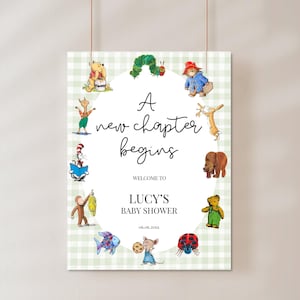 May include: A rectangular sign with a light green and white gingham border featuring watercolor illustrations of storybook characters surrounding the text A new chapter begins, WELCOME TO, LUCY'S BABY SHOWER, and the date 06.06.20XX in black font.