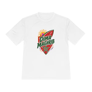 May include: A white short-sleeve t-shirt featuring a central graphic design. The graphic includes a red shield shape with a green star, a yellow sun, and the text DIMA MAGHRIB in dark green letters. The design incorporates orange and purple accents.