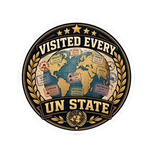 May include: A circular sticker featuring a world map background with various travel stamps from countries like Japan, France, Brazil, and the USA. The text reads VISITED EVERY UN STATE, framed by gold laurel wreaths and five stars at the top.