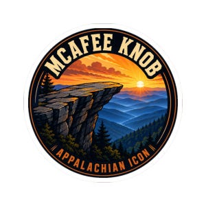 May include: A circular sticker featuring a landscape illustration of McAfee Knob at sunset. The design includes a rocky cliff overlooking blue mountain ridges, evergreen trees, and a bright orange sky. The text MCAFEE KNOB and APPALACHIAN ICON is printed in bold lettering along the black circular border.