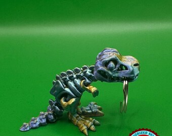 Brelok z ruchomym szkieletem T-Rexa – zabawka sensoryczna