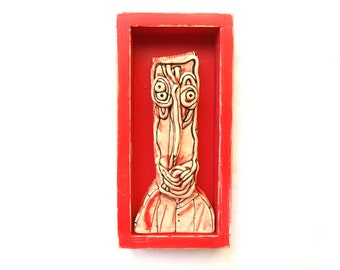 Shadowbox art, 3D art sculpture, Creepy doll faces, 3D wall sculpture, Wall shadowbox, Ceramic sculpture, red shadowbox, red scuplture