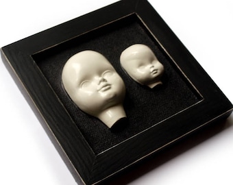 Baby doll heads, Ceramic doll heads, Doll heads in frame, Black and white art, Creepy doll heads,  3D sculpture, Porcelain doll heads