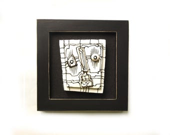 Modern Ceramic Face Sculpture: Black & White 3D Wall Art