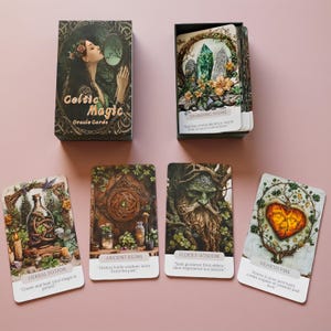 May include: A deck of Celtic Magic Oracle Cards featuring a box with a woman looking into a mirror and four individual cards titled Herbal Potion, Ancient Ruins, Elder's Wisdom, and Hearth Fire, each displaying detailed nature-themed illustrations.