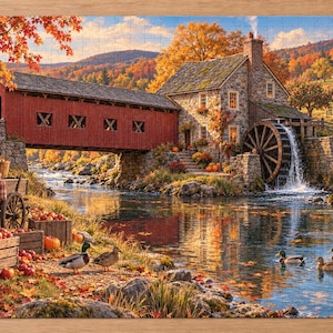 Op de afbeelding: Een rechthoekige legpuzzel met een herfstlandschap met een rode overdekte brug, een stenen watermolen met een draaiend wiel, een rivier, houten kisten gevuld met rode appels en verschillende eenden op de oever en in het water.