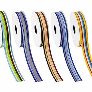 May include: Five spools of grosgrain ribbon, each featuring a distinct vertical striped pattern. The ribbons display color combinations including lime green, brown, blue, purple, beige, black, red, and yellow, all wound on white circular cores.