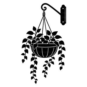 May include: A black silhouette graphic of a hanging plant in a bowl-shaped planter. The planter is suspended by three thin cords from a curved wall-mounted bracket. The plant features multiple trailing vines with heart-shaped leaves.