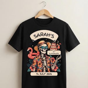 May include: A black t-shirt featuring a graphic of a skeleton wearing a straw hat, sunglasses, and a floral shirt. The design includes a pink flamingo float, a birthday cake, a cocktail, and text reading SARAH'S 30TH SUMMERWEEN 14 JULY 2026.