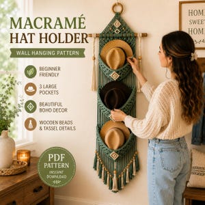 May include: A sage green macramé wall hanging featuring three deep pockets designed to hold hats. The piece is accented with natural wooden beads and long tassels at the bottom. Text on the image reads MACRAMÉ HAT HOLDER WALL HANGING PATTERN.