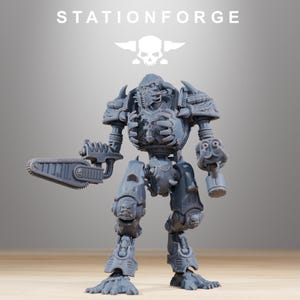 May include: A gray resin miniature robot figure from StationForge featuring a skull-themed chest plate, shoulder armor, and leg plating. The figure holds a large mechanical chainsaw in its right hand and a multi-barreled weapon in its left hand.