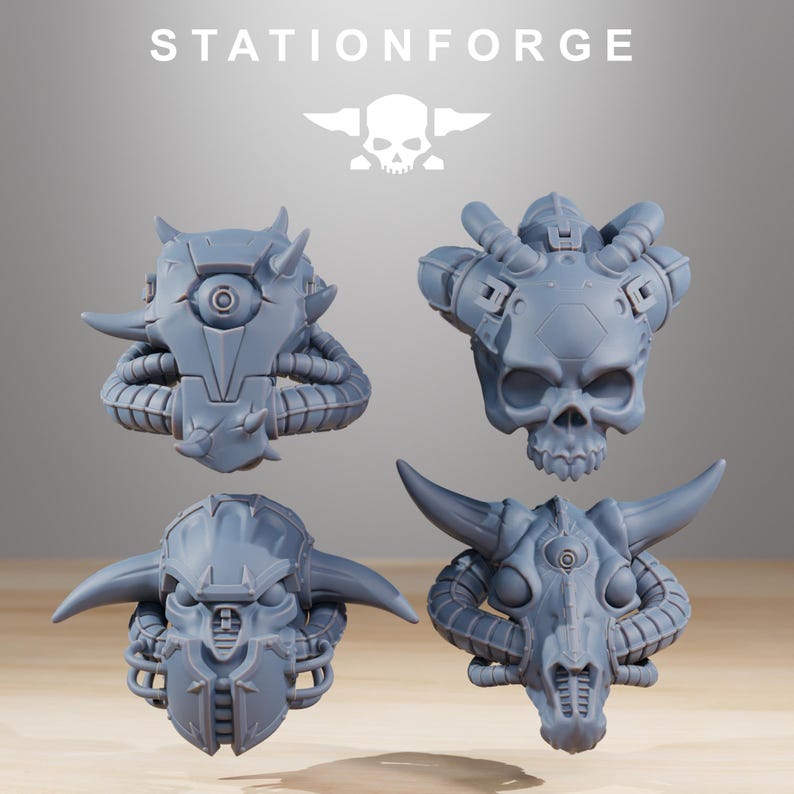 May include: Four grey resin miniature heads from StationForge, each featuring distinct sci-fi designs including a cyclopean helmet, a mechanical skull, a horned helmet with facial plating, and a skeletal creature head with large curved horns.