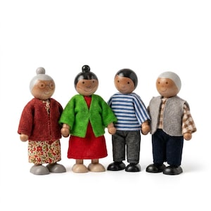 May include: A set of four wooden peg dolls representing a family. The figures feature painted faces, hair, and fabric clothing including a red cardigan, green jacket, blue striped shirt, and grey vest, all standing on small wooden circular bases.