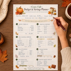 May include: A printed Cozy Fall Budget & Savings Planner sheet featuring sections for money coming in, essential expenses, fall seasonal expenses, needs versus nice-to-haves, fall fun budget, holiday buffer, savings goals, and a monthly money check-in.