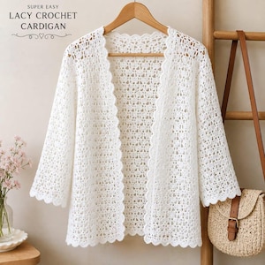 May include: A white open-front cardigan featuring a delicate lacy crochet pattern with scalloped edges along the front opening and sleeves. The text SUPER EASY LACY CROCHET CARDIGAN is printed in the upper left corner of the image.
