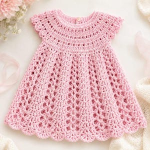May include: A light pink crochet dress featuring a round neckline with a single button closure at the back, short cap sleeves, and a flared skirt with an intricate openwork stitch pattern and a scalloped hemline edge.