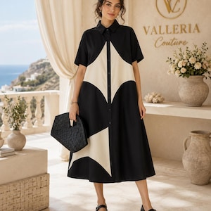 May include: A black and cream midi-length shirt dress featuring a bold geometric diamond pattern, a classic collar, short sleeves, and a full button-down front. The dress is paired with black Mary Jane shoes and a black woven handbag.