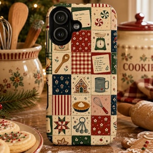 May include: A phone case featuring a patchwork quilt design with various baking-themed illustrations including a gingerbread house, measuring spoons, a whisk, a pie, and recipe cards for sugar cookies and gingerbread, all in a festive color palette.