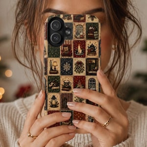 May include: A rectangular smartphone case featuring a grid pattern of small, square illustrations. The design includes various holiday-themed motifs such as a lit candle, a teapot, a lantern, a Christmas tree, a snowflake, and a mug of hot cocoa.