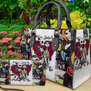 May include: A structured handbag and matching rectangular wallet featuring a collage print of Jack Skellington and Sally from The Nightmare Before Christmas, with the text "We're Simply Meant to Be" and dark grey handles with gold-tone hardware.