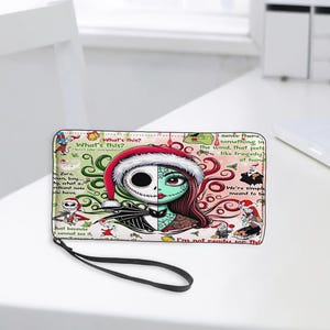 May include: A rectangular zip-around wallet featuring a split-face graphic of Jack Skellington and Sally from The Nightmare Before Christmas. The design includes a Santa hat, swirling green and red patterns, and various quotes like What's this?