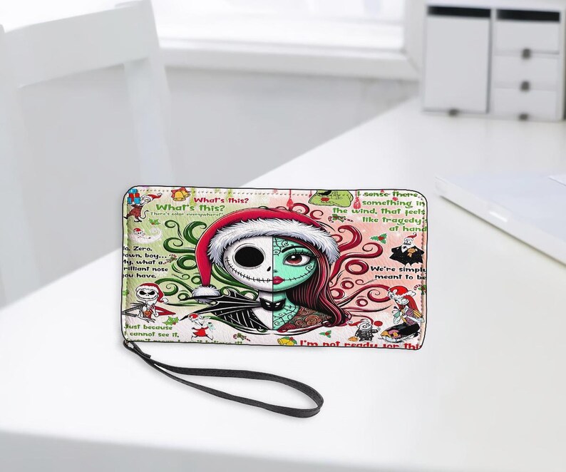 May include: A rectangular zip-around wallet featuring a split-face graphic of Jack Skellington and Sally from The Nightmare Before Christmas. The design includes a Santa hat, swirling green and red patterns, and various quotes like What's this?