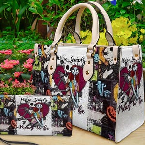 May include: A white handbag and matching rectangular wallet featuring a collage print of Jack Skellington and Sally from The Nightmare Before Christmas. The design includes the text "We're Simply Meant to Be" and various character graphics.