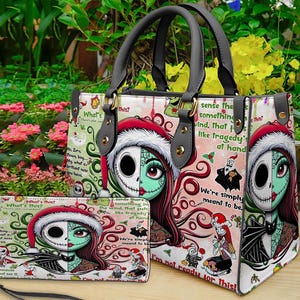 May include: A structured handbag and matching rectangular wallet featuring a split-face character graphic of a skeleton and a stitched-skin figure wearing Santa hats. The design includes red, green, and white patterns with text from a movie.