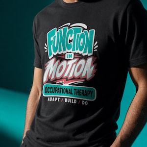 May include: A black short-sleeved t-shirt featuring a graphic design with the text "FUNCTION IN MOTION" in teal and white, "OCCUPATIONAL THERAPY" in a teal box, and the words "ADAPT / BUILD / DO" printed in white below the main graphic.