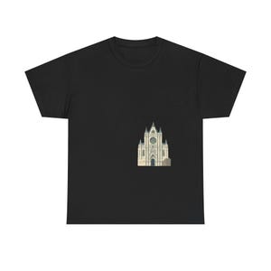 May include: A black short-sleeved t-shirt featuring a central graphic print of a beige gothic cathedral with pointed spires, arched windows, and a circular rose window detail positioned on the lower right side of the front of the garment.