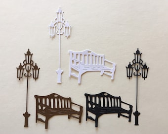May include: Three sets of decorative metal lamp post and bench cutouts. One set is white, one is brown, and one is black.