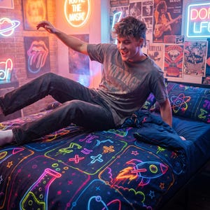 May include: A black duvet cover featuring a vibrant neon-style print of science and math symbols, including a rocket, an atom, a beaker, and mathematical equations in bright colours like pink, blue, yellow, and green against a dark background.