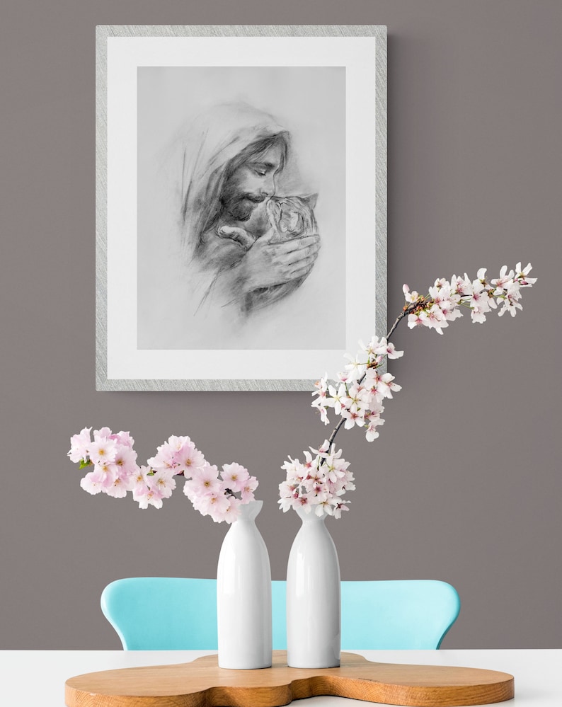 May include: A black and white pencil drawing of a person holding a cat. The person is wearing a hooded robe and has a beard. The cat is looking up at the person.