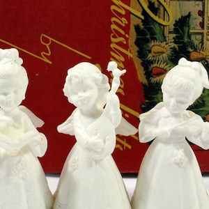 Three Mid-Century White Plastic Angel Musician Ornaments with Birds, Made in Hong Kong