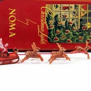 Retro Miniature Plastic Santa in Red and Brown Sleigh with Five Tiny Brown Spotted Reindeer