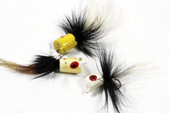 Three Vintage Feather Poppers Fishing Lures Yellow, Black, and