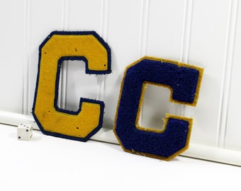Two Small Royal Blue and Gold Block Varsity Letter Cs