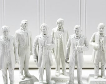 Six Vintage Unpainted Marx Toy President Figurines; White Plastic Fillmore, Pierce, Buchanan, Lincoln, Johnson, & Grant Dolls